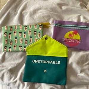 Three Ipsy makeup bags